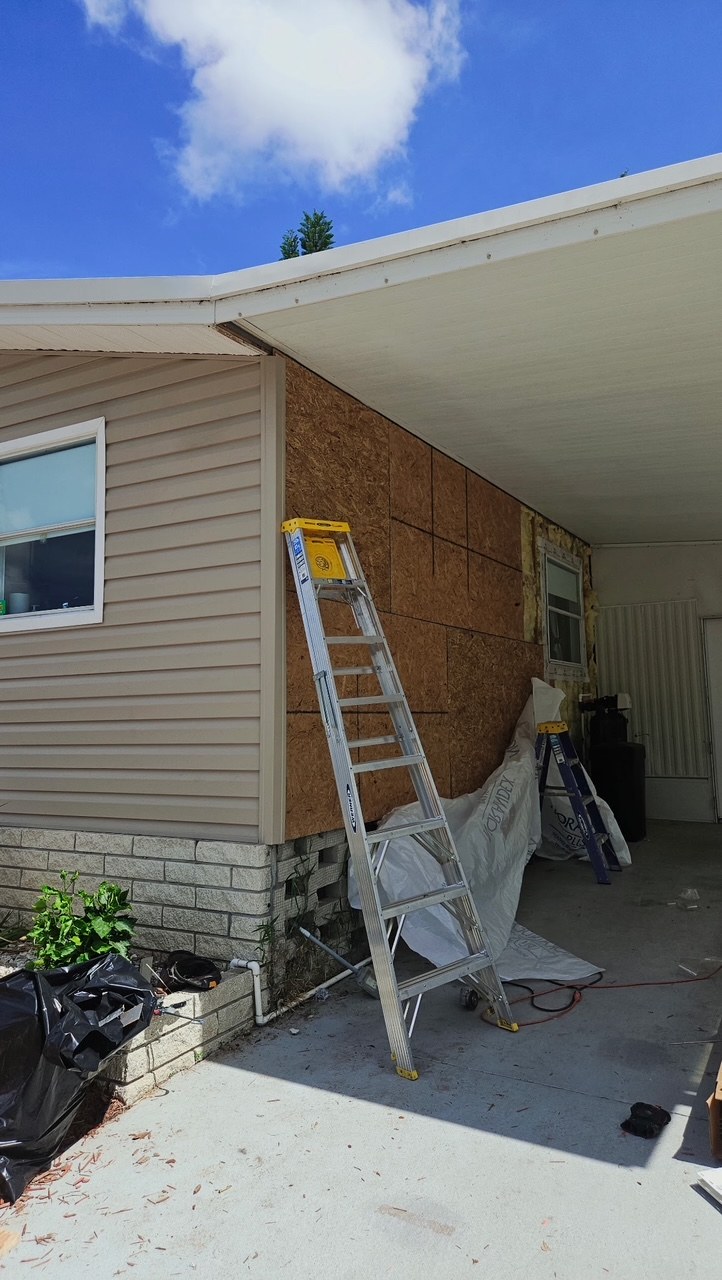 Exposed mobile home wall sheathing during an RFH siding installation